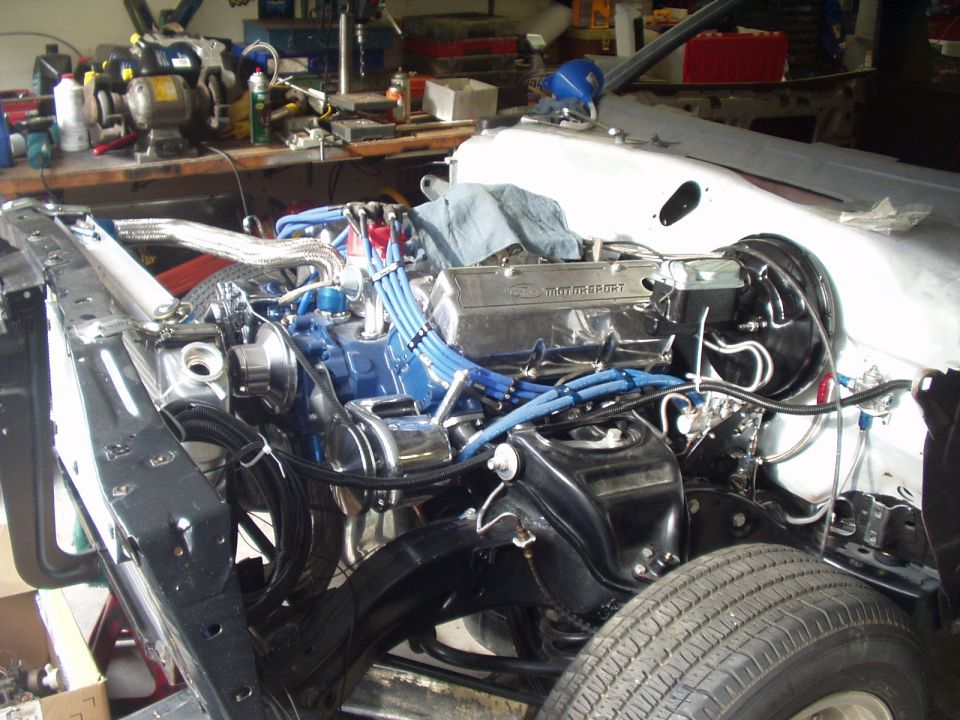 Engine bay with Ford Motorsport valve cover and blue spark plug wires