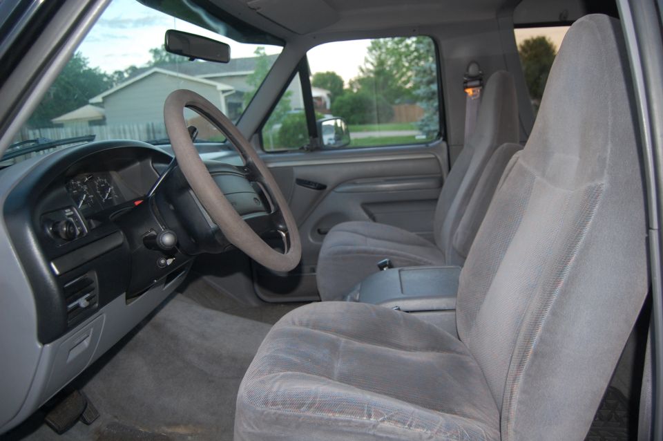 Interior view of a 1992 Ford F-Series truck showing the dashboard, steering wheel, and front seats