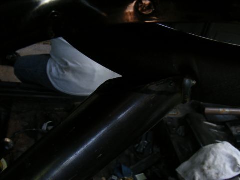 1989 Ford Escort - Detail shot of an unidentified car interior component, focus on dark metal structure.