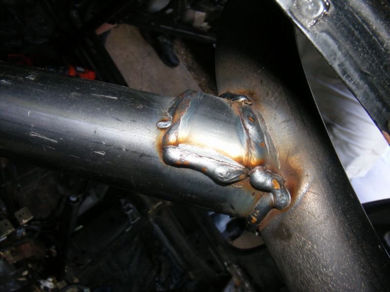 Welded metal tubing with rust and discoloration