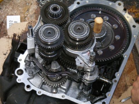 1989 Ford Escort - Internal view of transmission gears and components, showing complex mechanical assembly.