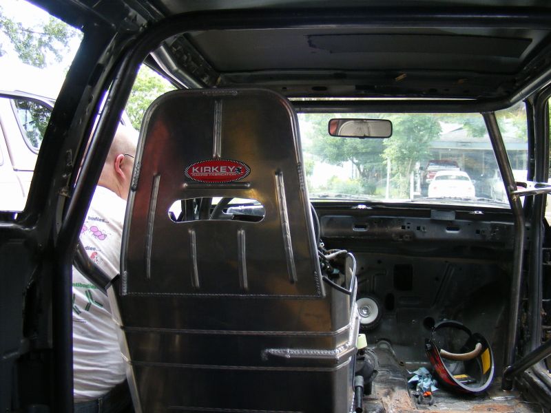 Interior of a race car with a Kirkey racing seat and roll cage