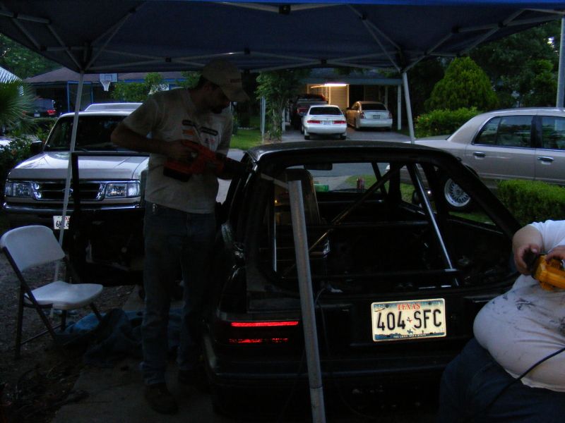 Black car with roll cage, rear view, license plate 404 SFC