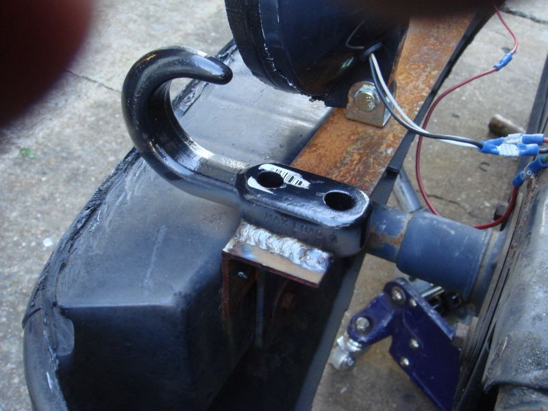 Close-up of a welded tow hook assembly with electrical wiring