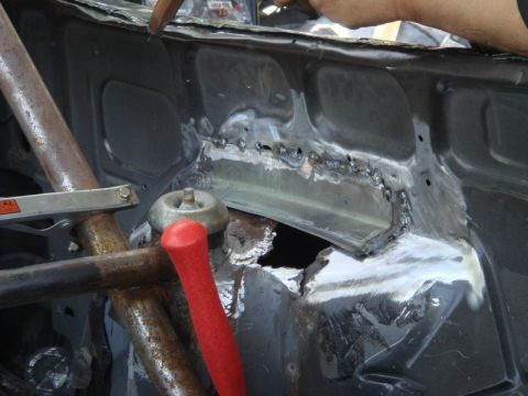 1989 Ford Escort - Firewall undergoing repair work with visible welding and metalwork.