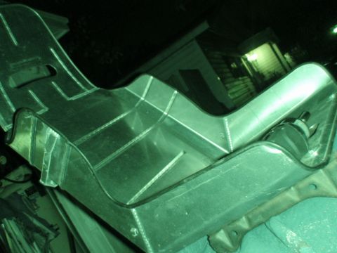 1989 Ford Escort - Custom metal racing seat shown from an angle, with a mounting bracket visible.