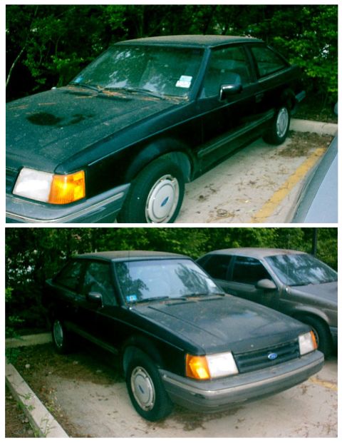 1989 Ford Escort - A black Ford Escort from the mid-1980s is parked next to another vehicle.