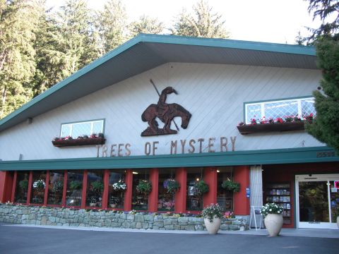 1991 Ford Bronco - The facade of the Trees of Mystery gift shop features a large cowboy and horse sculpture and the store's name.