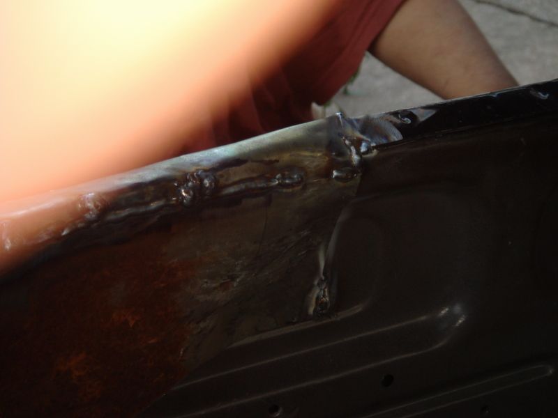 Welding on black car door edge