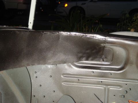 1989 Ford Escort - Detail of welded seams on a vehicle's structural frame component.