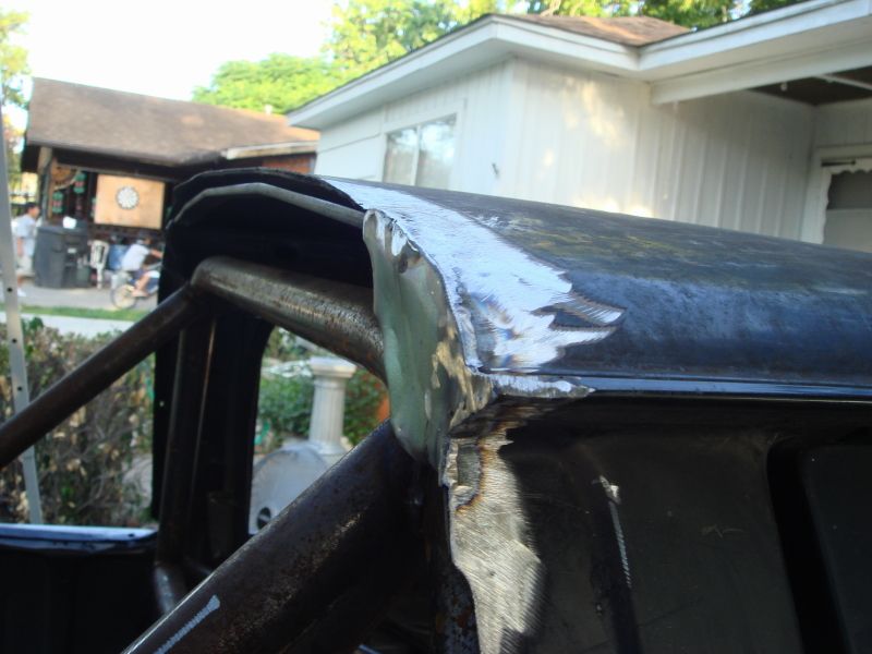Welding on the roof of a black vehicle