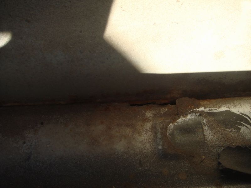 close-up of rusted metal frame with shadow