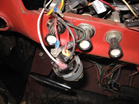 1966 Ford F-100 - Exposed wiring and switches on a vehicle's dashboard, showing ignition and wiper controls.