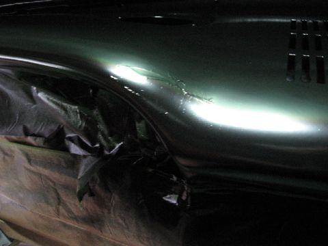 1966 Ford F-100 - The dashboard of a 1966 Ford F-100 is covered in black plastic sheeting, likely for a repaint.