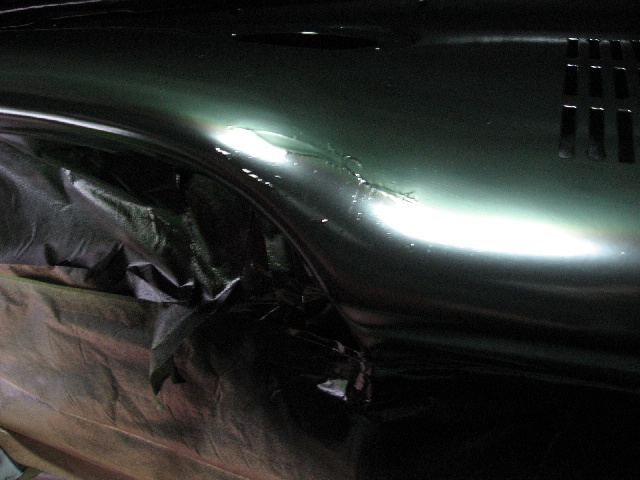 1966 Ford F-100 dashboard with green paint and black plastic sheeting