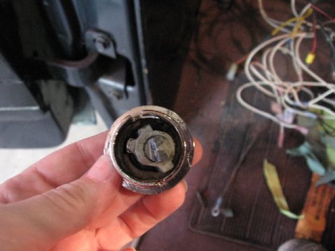 1966 Ford F-100 - Close-up of a removed door lock cylinder, showing internal mechanism.