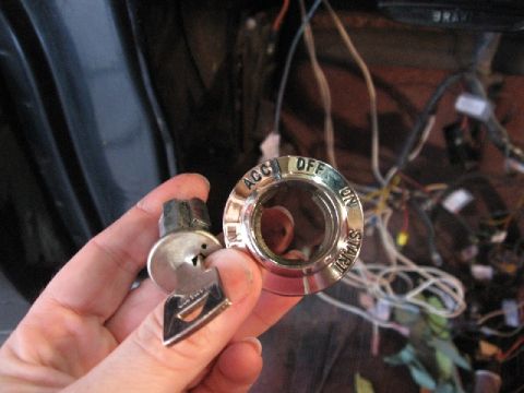 1966 Ford F-100 - Close-up of an ignition switch and key, with visible labels for ACC, OFF, ON, and START.