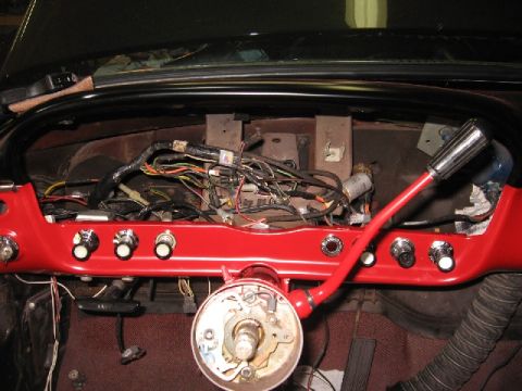 1966 Ford F-100 - The exposed wiring and components on the dashboard suggest a vehicle interior undergoing maintenance.