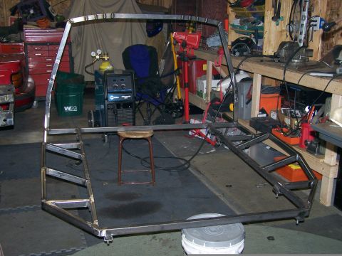 1988 Suzuki Samurai - Custom metal fabrication project underway in a workshop, showing a bare frame structure.