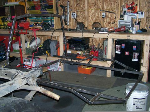 1988 Suzuki Samurai - Custom roll cage fabrication in progress inside a workshop.