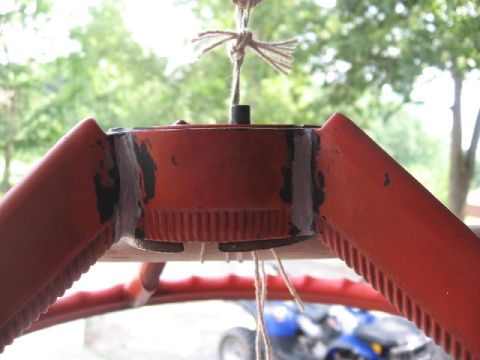 1966 Ford F-100 - Steering wheel hub showing splines and repair work, suspended by twine.