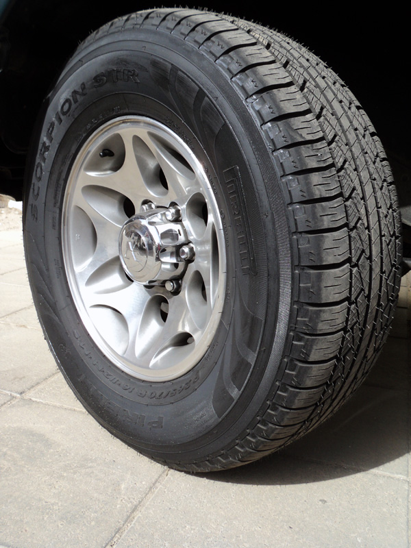 Pirelli Scorpion STR tire on silver 6-spoke alloy wheel on paved ground