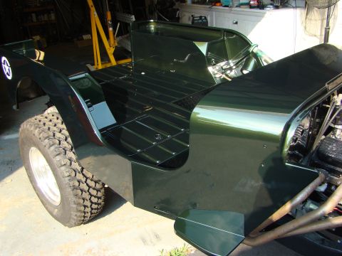 1948 Jeep Wrangler - This Jeep CJ-3A is undergoing restoration, with its body panels freshly painted and some mechanical components exposed.