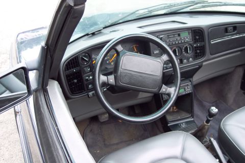 2001 Ford Crown Victoria - Interior view of a 1992 Saab 900 Convertible, showing the dashboard, steering wheel, and seats.