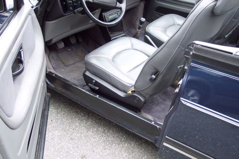 2001 Ford Crown Victoria - Interior view of a car, showing the seats, dashboard, and door panel. The vehicle appears to be a convertible.