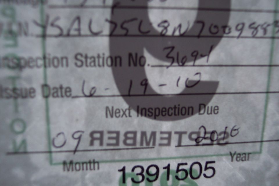 Vehicle inspection document with handwritten dates and numbers