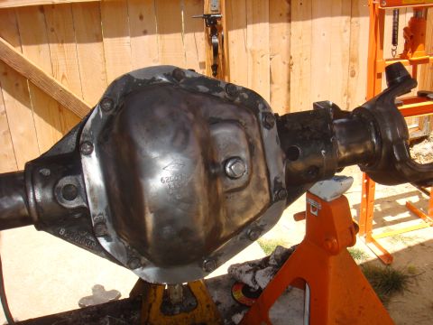 1992 Ford Bronco - A vehicle's rear axle assembly is shown supported by jack stands, ready for work.