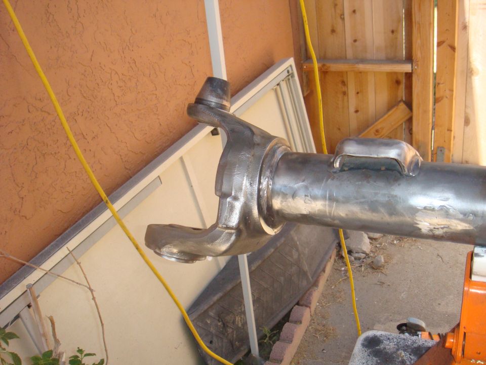 Close-up of a metal axle part with a U-joint