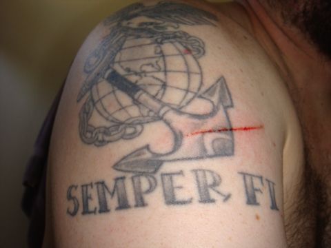 1992 Ford Bronco - Tattoo of the US Marine Corps emblem and 'SEMPER FI' on a shoulder.