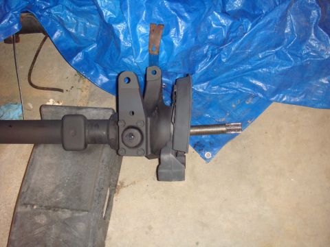 1992 Ford Bronco - A close-up view of a vehicle's axle assembly, likely undergoing maintenance or repair.