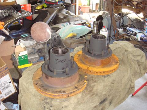 1992 Ford Bronco - Axle hubs and brake rotors are shown, with visible rust and wear on the metal components.
