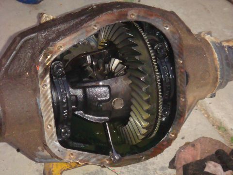 1992 Ford Bronco - Differential housing with internal gears visible, part of a vehicle's drivetrain.