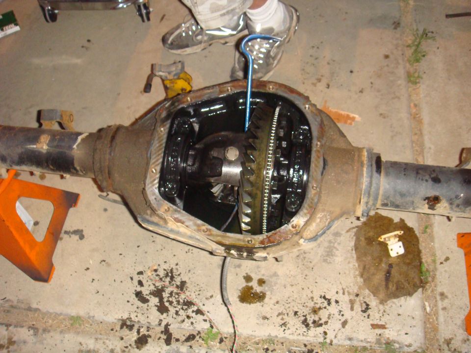 Differential assembly with gears exposed, being worked on