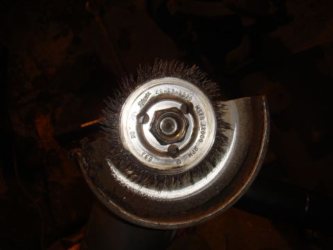 1992 Ford Bronco - Close-up of a wire wheel brush attached to a grinder, showing its specifications.