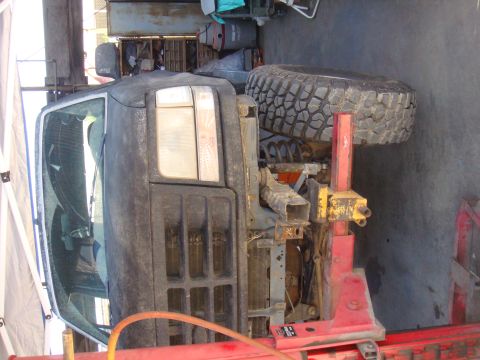 1992 Ford Bronco - This 1992 Ford Bronco is shown from the front quarter angle, a black exterior and lifted suspension.