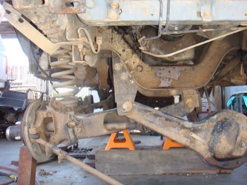 1992 Ford Bronco - Undercarriage view of a 1992 Ford Bronco, focusing on the rear axle and suspension system.