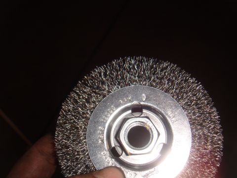 1992 Ford Bronco - A close-up view of a wire wheel brush, likely used for cleaning or surface preparation.