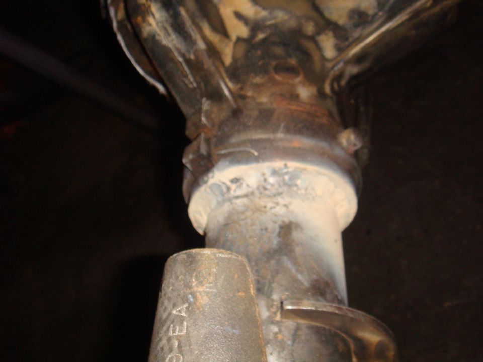 Rear axle differential housing with visible text '9-EA'