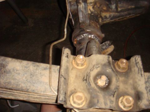 1992 Ford Bronco - This photo shows a close-up of a vehicle's rear axle, focusing on welded repairs and mounting hardware.