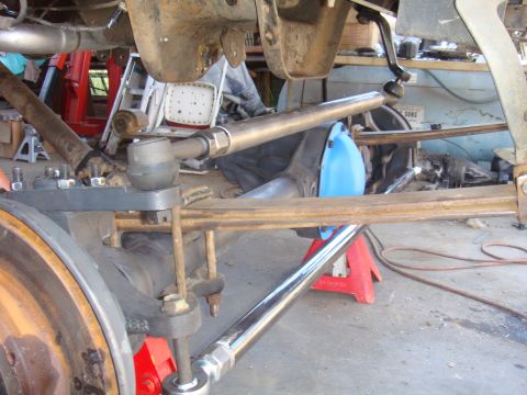 1992 Ford Bronco - Vehicle suspension and steering components are visible, with parts on jack stands.