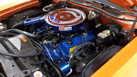 1973 Ford Ranchero - Engine bay detail showing a Ford V8 engine with a prominent air cleaner assembly.