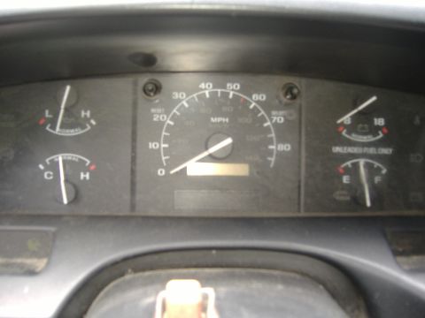 1995 Ford F-150 - The vehicle's interior dashboard shows various gauges, including the speedometer, fuel, and temperature indicators.