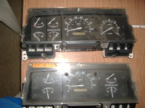 1995 Ford F-150 - Two vehicle instrument clusters are shown, likely for repair or replacement.