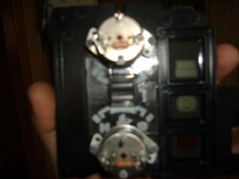1995 Ford F-150 - Close-up of an automotive dashboard instrument cluster component, showing gauges and displays.