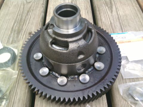 1995 Ford Bronco - Close-up of a differential carrier and ring gear assembly, with packaging visible.