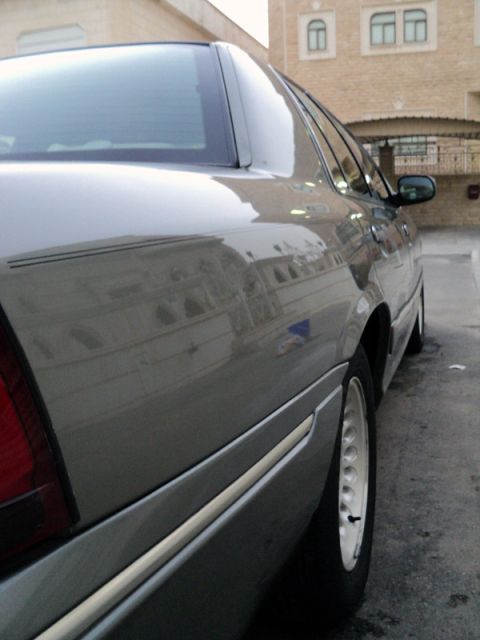 2001 Mercury Grand Marquis - Rear quarter panel view of a silver 2001 Mercury Grand Marquis sedan.